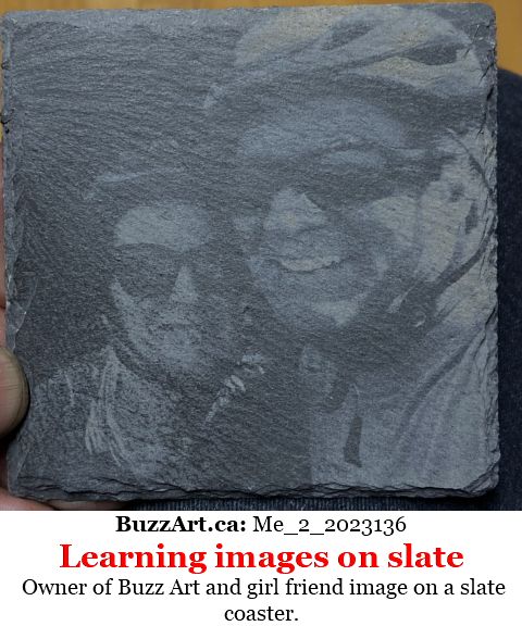 Owner of Buzz Art and girl friend image on a slate coaster.